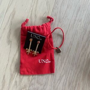 Uno de 50 earrings. Comes with charm. Never been worn.